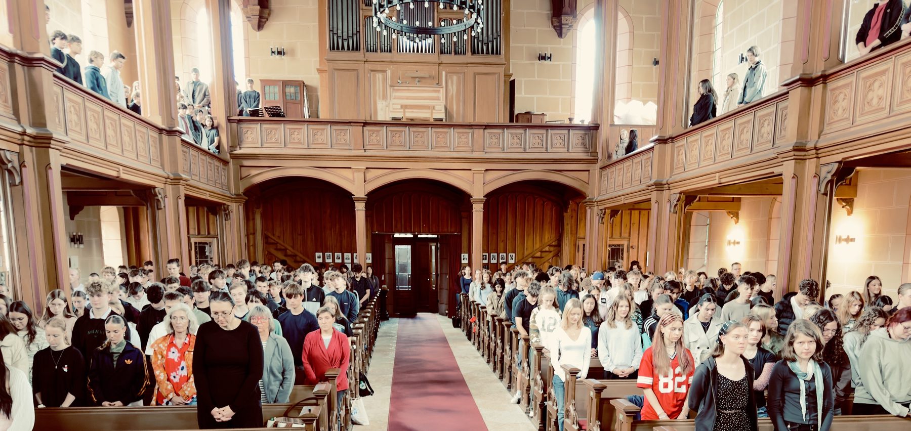 Students at a performance in a church
